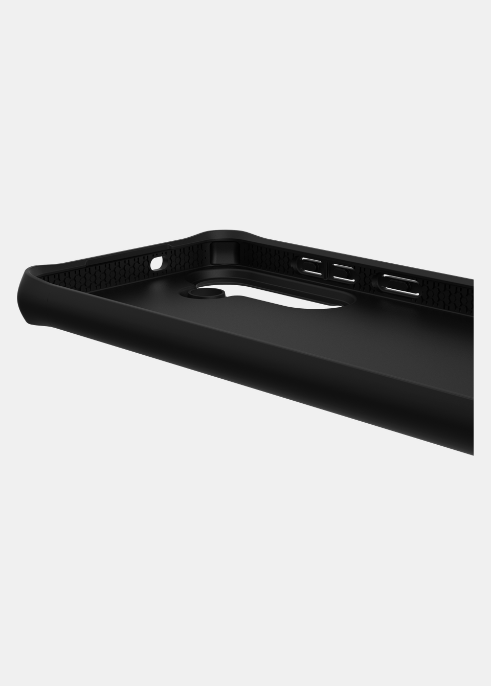 Inside edge of the black SPECTRUM R BOLD case for Galaxy S26 FE, showing the shock-absorbing internal structure and button cut-outs