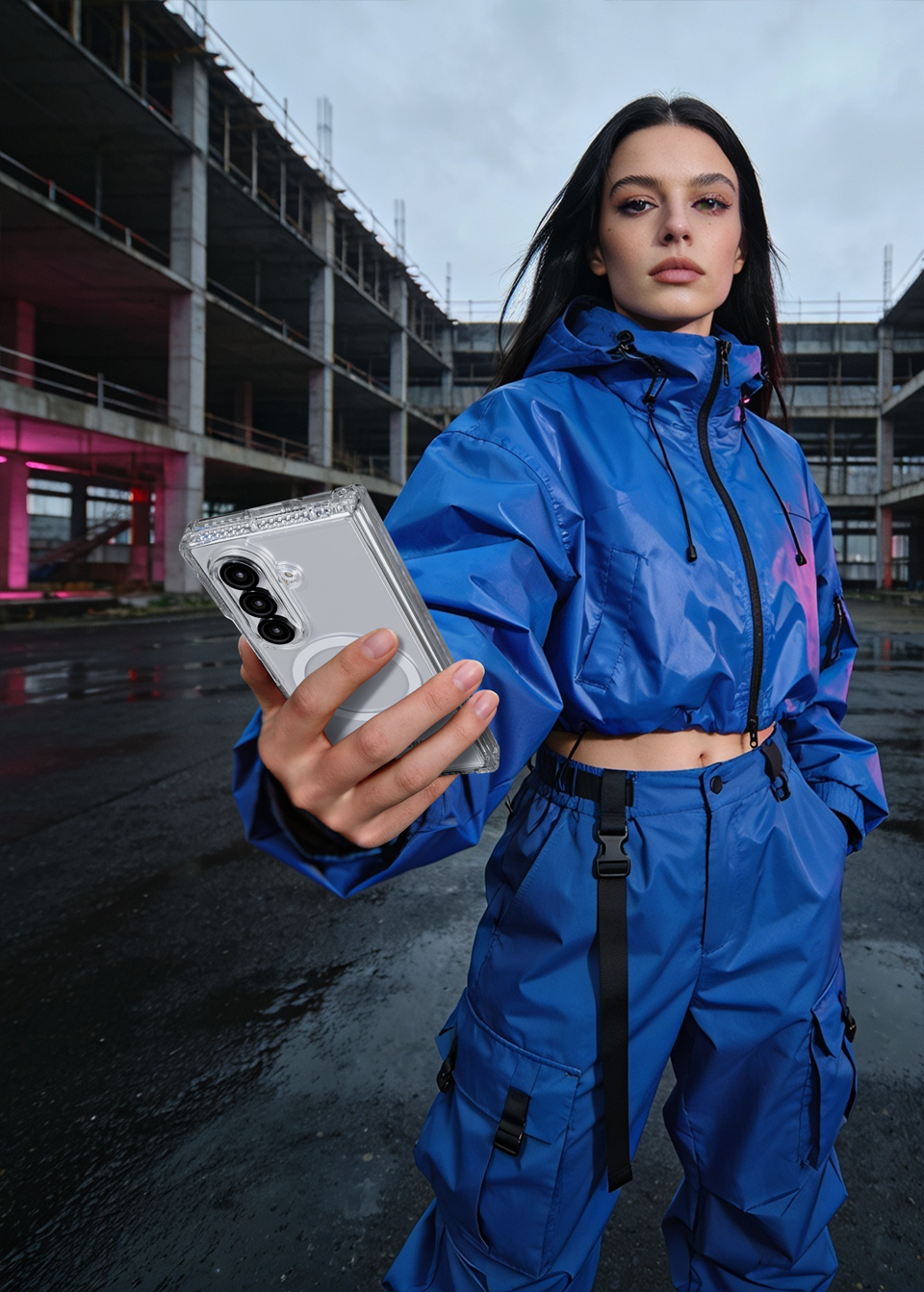 Samsung Galaxy Z Fold 8 Ultra in a clear ITSKINS case held by a woman in a blue jacket in a wet urban setting